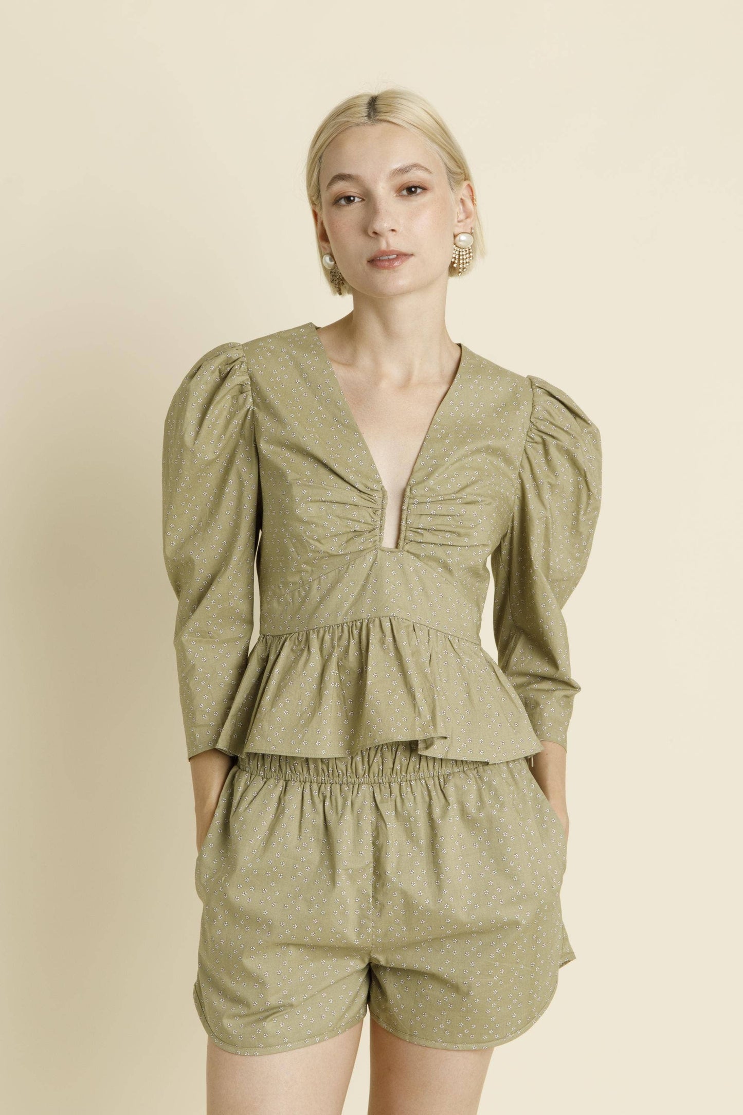 U-Ring Trim Peplum Blouse