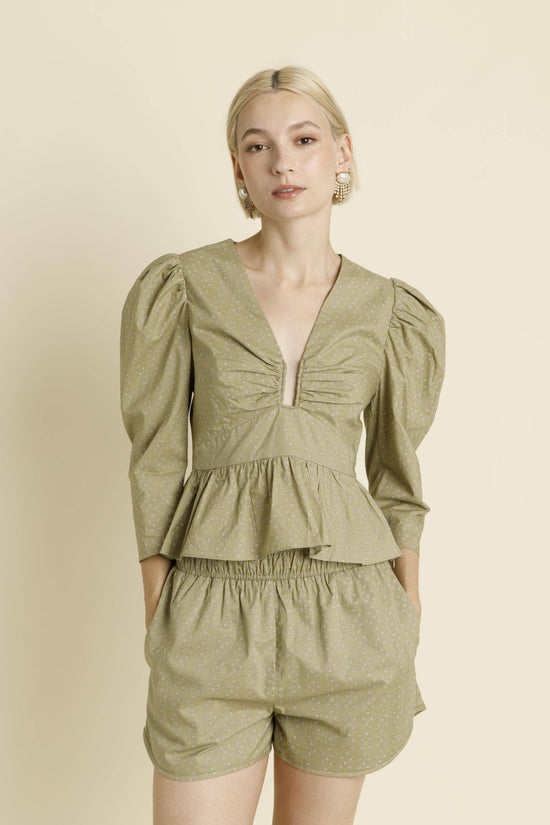 U-Ring Trim Peplum Blouse